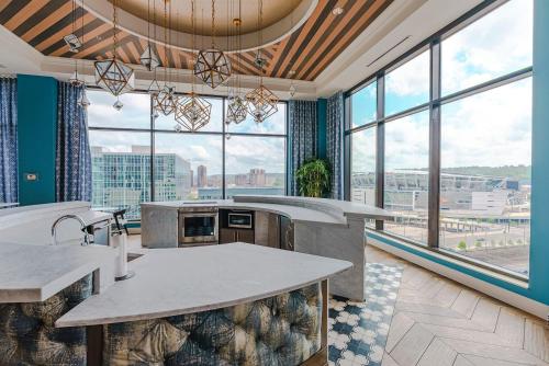 a large kitchen with large windows in a building at 2 BHK Unit In Core Downtown Cincy in Cincinnati