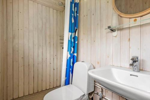 a bathroom with a toilet and a sink at 30401-Odder-Stakket-Torn-12 in Odder