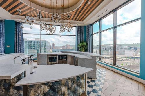 a large kitchen with large windows in a building at Stylish 1 Bed In Downtown Cincinnati in Cincinnati