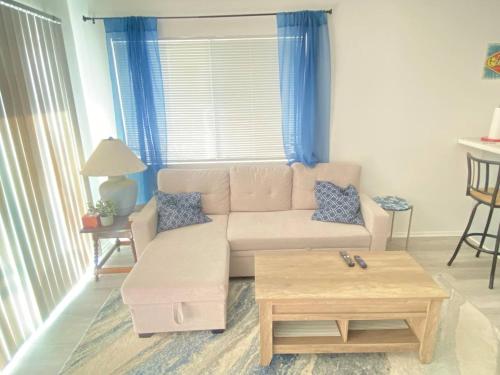 a living room with a couch and a coffee table at Sea View, Boards, Bikes, Wd in Oxnard