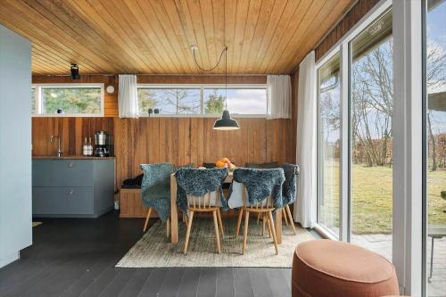 a kitchen and dining room with a table and chairs at 30325-Odder-Rythiavang-22 in Odder