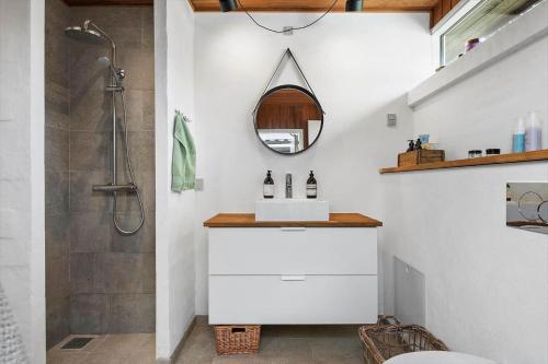 a bathroom with a sink and a shower at 30325-Odder-Rythiavang-22 in Odder