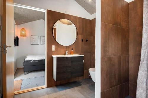 a bathroom with a sink and a mirror at 30477-Odder-Strandvaenget-2 in Odder