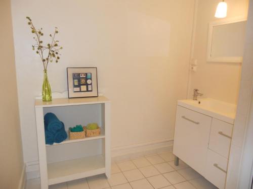 a bathroom with a sink and a white cabinet at le gambetta in Lyon