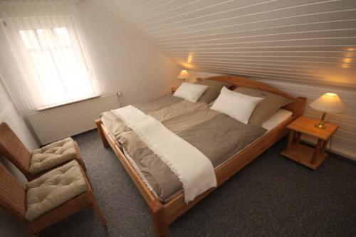Postel nebo postele na pokoji v ubytování Nordsee Haus An't Oll Deep