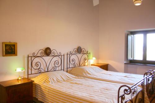 מיטה או מיטות בחדר ב-Olivo