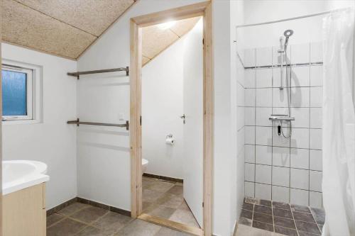 a bathroom with a shower and a sink at M235-Vaeggerlose-Kaninstien-33 in Bøtø By