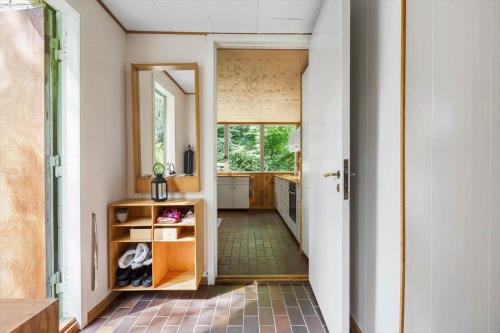 a hallway of a house with a kitchen and a door at 1601-Melby-Muldbjergvej-1 in Melby