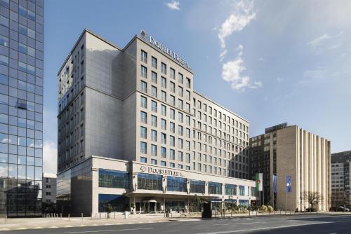 a rendering of a large building in a city at Doubletree by Hilton Ljubljana in Ljubljana