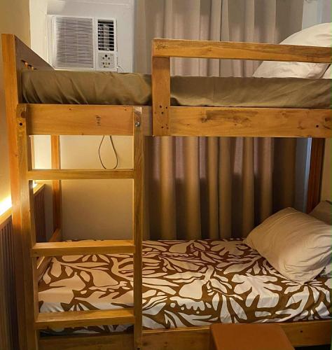 a couple of bunk beds in a room at TuksHotel in Manila