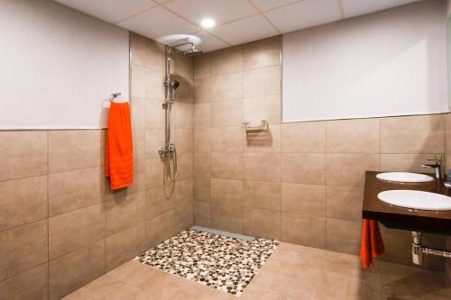 a bathroom with a shower with a sink and a toilet at Casa de 7 suites y vistas 360. Les Feixes Llargues in Bolvir