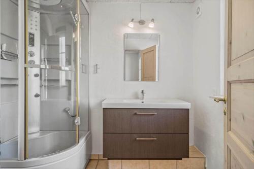 a bathroom with a sink and a shower at 30876-Ulfborg-Krogsgardvej-5 in Ulfborg