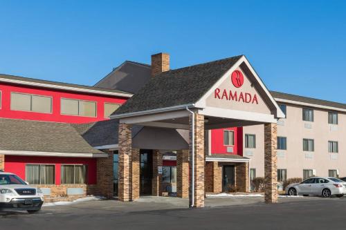 a hotel with a sign that reads ramada at Ramada by Wyndham Platte City KCI Airport in Platte City