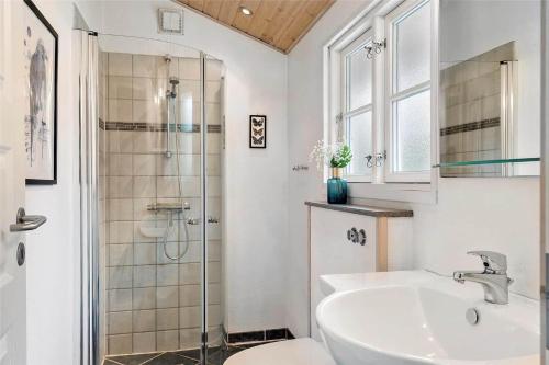 a bathroom with a sink and a shower at 30121-Ulfborg-Klovervej-474 in Ulfborg