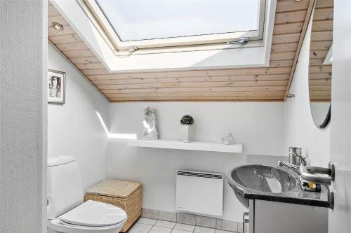 a bathroom with a sink and a skylight at 30071-Ulfborg-Klovervej-479 in Ulfborg