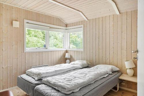 two beds in a room with two windows at 80608-Vemb-Knudehus-51 in Vemb