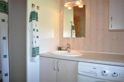 a bathroom with a sink and a mirror at 30070-Ulfborg-Klovervej-478 in Ulfborg