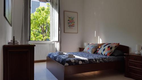 Cama o camas de una habitación en BnButler - Sempione Apartment - MiCo
