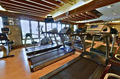 a gym with two treadmills and a treadmill at Silom Serene A Boutique Hotel in Bangkok