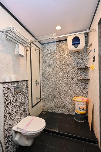 a bathroom with a shower and a toilet in it at Harnawa Haveli - A Boutique Heritage Stay in Jaipur in Jaipur