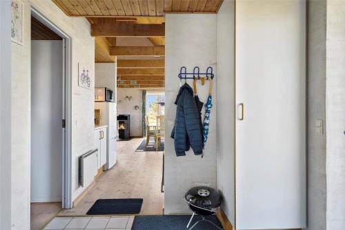 a hallway of a house with a kitchen and a door at 20238-Ulfborg-Bankvej-1 in Ulfborg