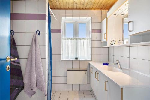 a bathroom with a sink and a window at 20238-Ulfborg-Bankvej-1 in Ulfborg
