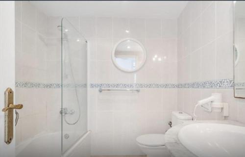 a bathroom with a shower and a toilet and a sink at Apartment for 6 with a private terrace in Son Bou in Son Bou