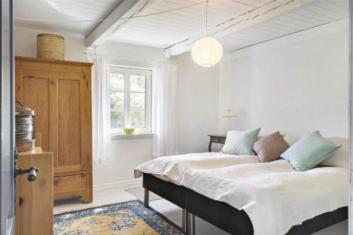 a bedroom with a bed and a window at 20033-Ulfborg-Vesterhavsvej-15 in Ulfborg
