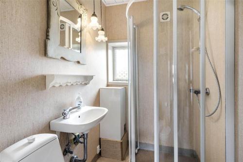 a bathroom with a toilet sink and a shower at 20261-Ulfborg-Vederso-Klitvej-20 in Ulfborg