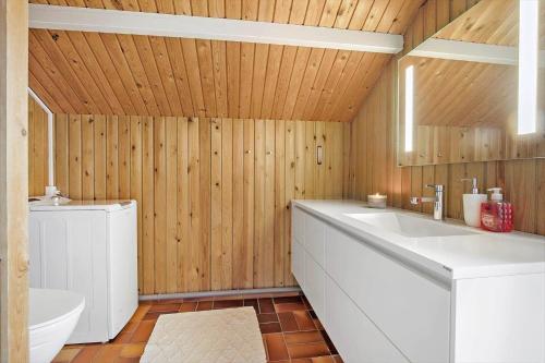 a bathroom with a white sink and a toilet at SL308-Slagelse-Jarlsvej-23 in Slagelse