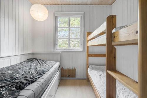 a bedroom with a bunk bed and a ladder at SL325-Slagelse-Ringduevej-6 in Slagelse