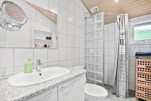 a white bathroom with a sink and a toilet at K19045-Kalundborg-Lobelievej-3 in Kalundborg