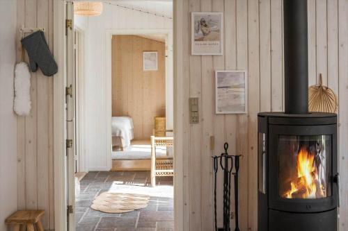 a fireplace in a room with a living room at K20092-Gorlev-Skovhusvej-27 in Gørlev