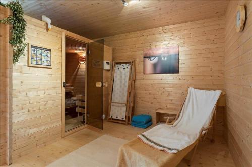 a room with a sauna with a chair in it at KAL097-Gullaskruv-Hetalaga-107 in Gullaskruv