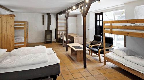a dorm room with two bunk beds and a desk at SL349-Slagelse-Kongsmarkvej-259 in Slagelse