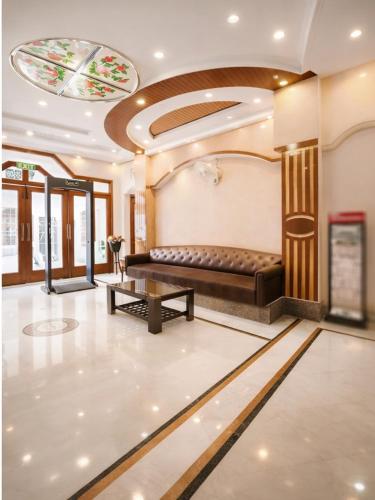 a waiting room with a couch and a table at Hotel C Park, Karol Bagh, New Delhi in New Delhi