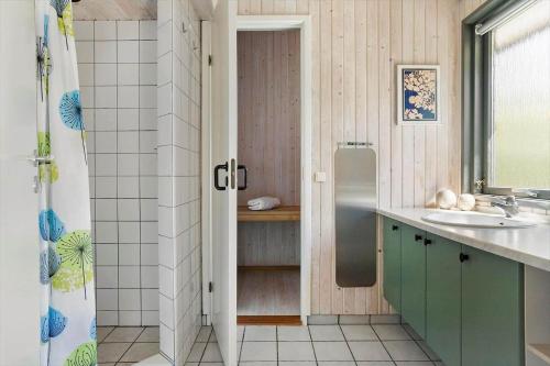 a bathroom with a shower and a sink at 20220-Samso-Rosenvej-25 in Tanderup