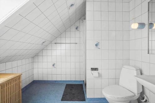 a bathroom with a toilet and a sink at 20212-Samso-Saelvig-50 in Sælvig