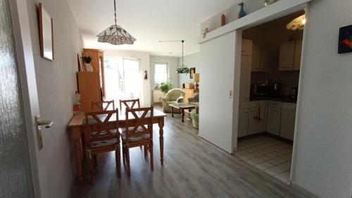 a kitchen and dining room with a table and chairs at FW Wölfer in Velten
