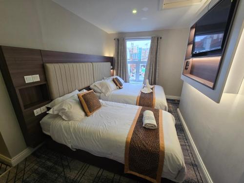 Sjónvarps- og/eða afþreyingartæki á Double bedroom studios