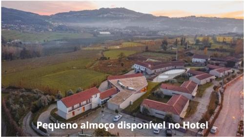 an aerial view of a town with buildings and a mountain at Quinta da Corredoura, Hotel Rural in Guimarães