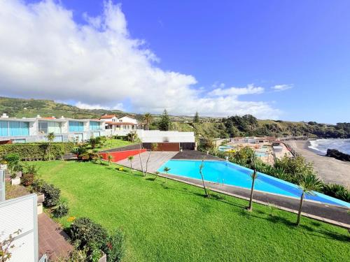 an image of a swimming pool in a yard at Marina Mar II Premium in Vila Franca do Campo