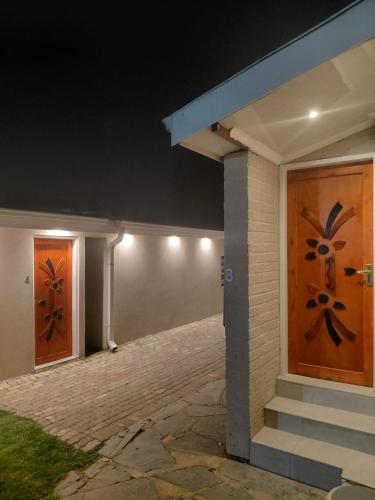 two doors on a house at night at Kliprivier Accommodation in Johannesburg