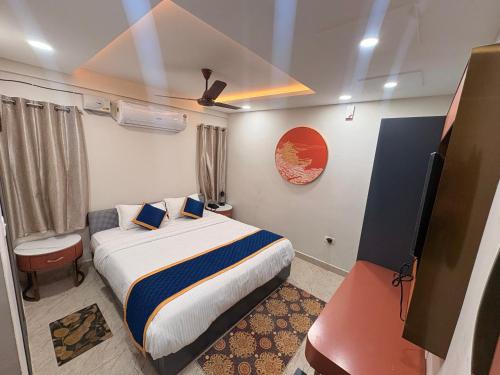a bedroom with a bed in a room at Farm Shaala in Tiruttani