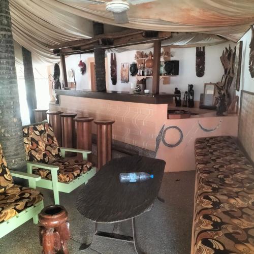 a room with a table with a bottle on it at Mar Setal in Mar Lodj