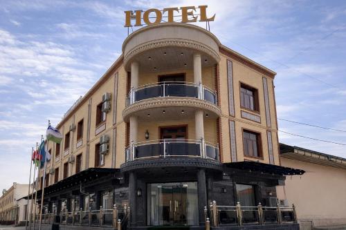 a building with a hotel sign on top of it at AMIR PLAZA hotel in Akmechetʼ
