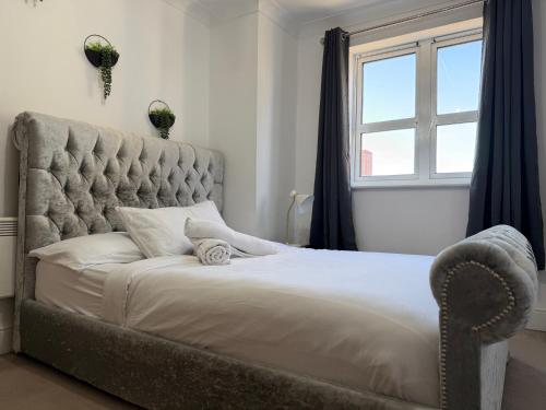 a bedroom with a large bed and a window at One bedroom Flat in Birmingham City Centre with free underground parking in Birmingham