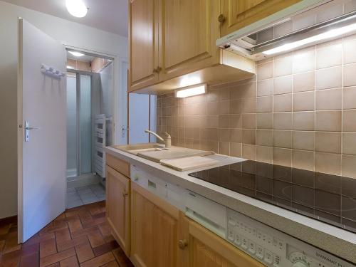 a kitchen with a sink and a counter top at Studio 3*** aux pistes, cheminée, animaux admis, garage - FR-1-304-111 in La Clusaz