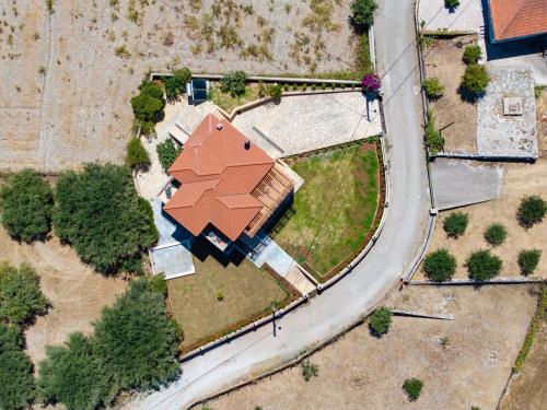 an overhead view of a house with an orange roof at Villa Ourania near Myrtos in Divarata