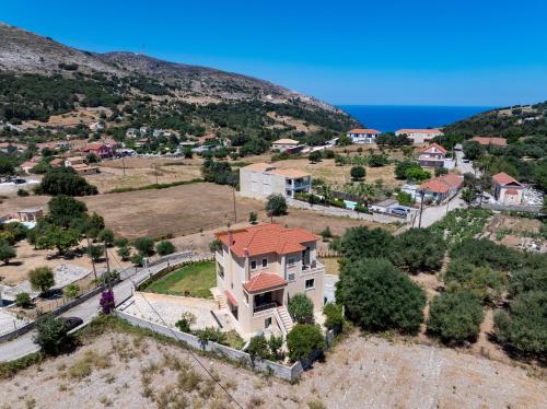 an aerial view of a house with a red roof at Villa Ourania near Myrtos in Divarata